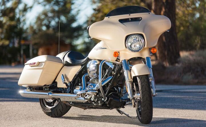 The shorty windshield on the Street Glide makes it easy to see over. The fairing vent reduces turbulence at speed.