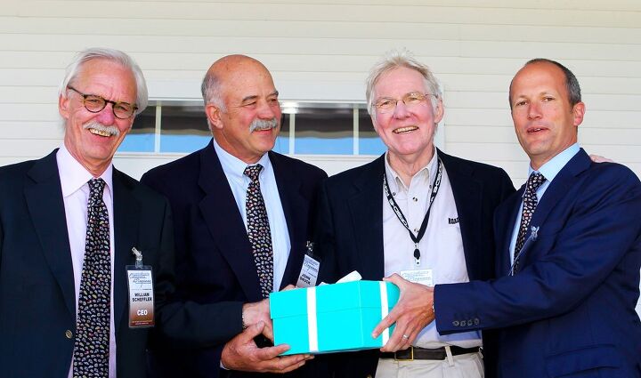 Here’s Peter (second from right) at a recent Fairfield County Concours d‘Elegance, being presented with a large box of currency. (The box appears too light to contain gold bars.)