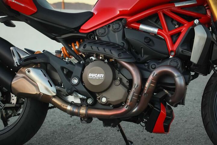 Ducati should direct some Italian design and taste towards the left side of the engine where the ugly hoses and the water outlet resides.