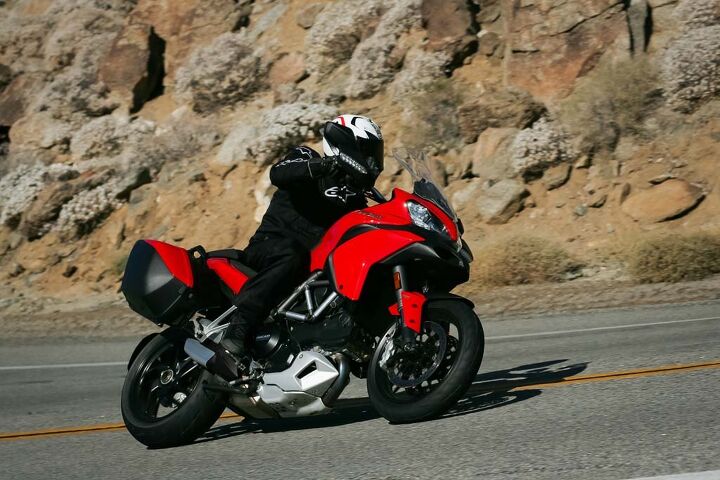 The Ducati Twin throbs at 80 mph/4,500 rpm in top-gear. Its handling demands you keep pressure on the inside bar through sweeping corners. Short legs beware, the Multi’s seat is claimed to be 33.5 inches from the ground and feels even taller.