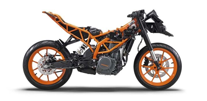The RC390's liquid-cooled Single uses a stacked transmission layout to keep the wheelbase short while having a desirably long aluminum swingarm. Powdercoated tubular-steel trellis frame looks way sexier than the chassis of any other beginner-friendly sportbike. Robots do nice welding.