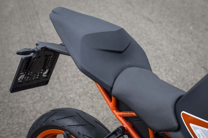 What looks like a matte-black tailsection is actually a pillion seat made of a Canadian-sourced material that is used on a motorcycle for the first time ever. Grab handles are nicely integrated beneath.