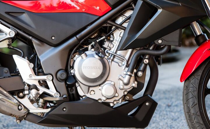 Compared to the kickstarters and air-cooling fins of some of the other bikes here, the 286cc Single in the CB300F seems futuristic by comparison. Dual overhead cams, four valves per cylinder and liquid-cooling all help it achieve a healthy 26 horses.