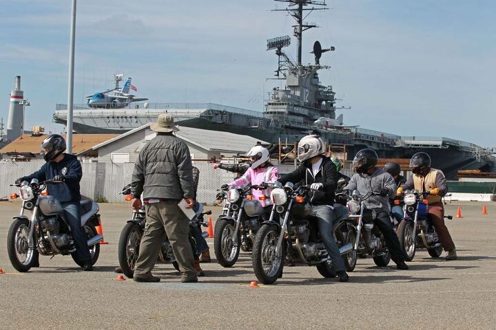 MSF RiderCoach Rob Kong leads a class through a counter-steering drill with the USS Hornet in the background.