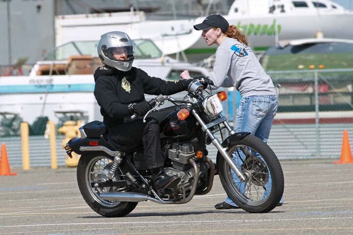 MSF RiderCoach Heidi Burbank coaches a student through a turn. Yes, she knows the throttle is on the right.