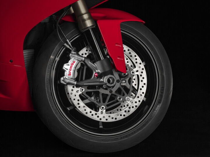The Brembo M50 calipers latch onto 330mm discs, but the big news is the addition of Cornering ABS.