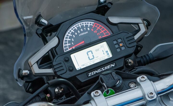 The digital speedo has a gear position indicator and a fuel gauge, however, the fuel gauge was showing empty with a half-tank remaining. Idiot lights are small and dim.
