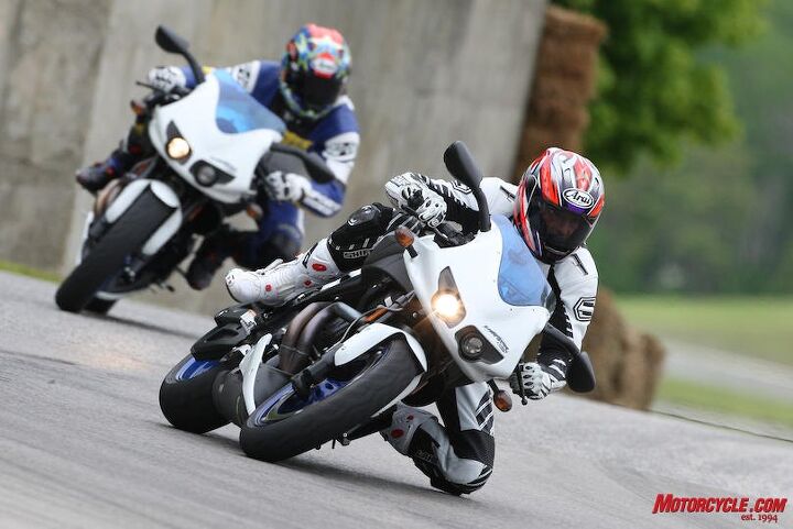 And, sixth, my Moto-GT teammate was Troy Siahaan (blue leathers, from a Buell trackday at RA a few days before our race), a young editor from Sport Rider magazine who has since become a valued addition to the pages of MO.