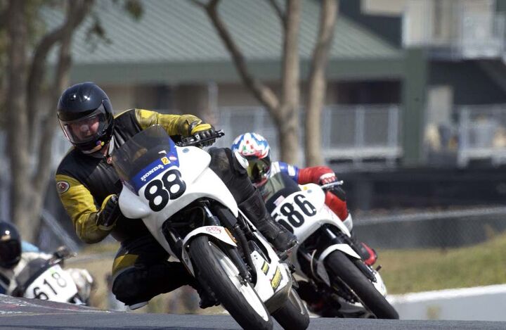 Jack Walsh, a very large and fast man racing his suspiciously fast Honda VTR250. In this photo, snapped in Sonoma Raceway's Turn 2 c. 2002, he shows off his legendary speed and smoothness. Photo by Gary Rather.