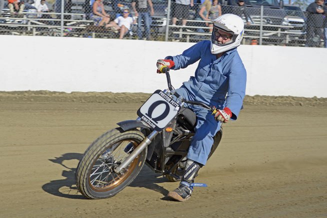 AMA Hall of Fame member Preston Petty skids his Zero electric motorcycle into a corner during a Southern California Flat Track Association meet at Perris Raceway. Petty, 74, has always favored technology over tradition. He is the first motorcycle racer to adapt an electric bike for use in flat-track racing. Photo by Scott Rousseau