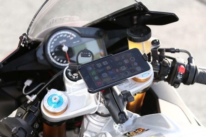 One aspect of this launch was unprecedented: the test bikes were fitted with iPhones! Aprilia's V4 Multimedia Platform app connects the RSV4 to smartphones and, then, the motorcycle to the internet!