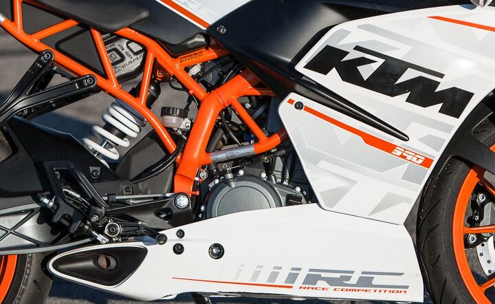 The distinctly orange KTM trellis frame houses, among other things, a preload adjustable WP shock. Note its close proximity to the exhaust hump in black directly in front. We theorize exhaust heat could be affecting the shock’s damping abilities, as its lack of rebound damping saps confidence to push its limits. Kudos to KTM, though, for equipping the RC with Pirelli Diablo Rosso II tires, stock.