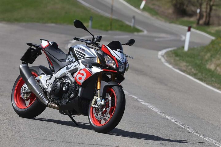For the first time, Aprilia is offering a Factory version of the V-4 Tuono, seen here in its Superpole graphic. Retailing for a $2,200 premium over the $14,799 RR, it includes Ohlins suspension and steering damper, aluminum (rather than the RR’s steel) front brake rotor flanges, a wider 200/55-17 rear tire and red wheels – wheels are not the lighter, forged-aluminum hoops sometimes fitted to Aprilia’s Factory models. The $16,999 Factory is scheduled to arrive in American dealers this month, a couple of months ahead of the RR.