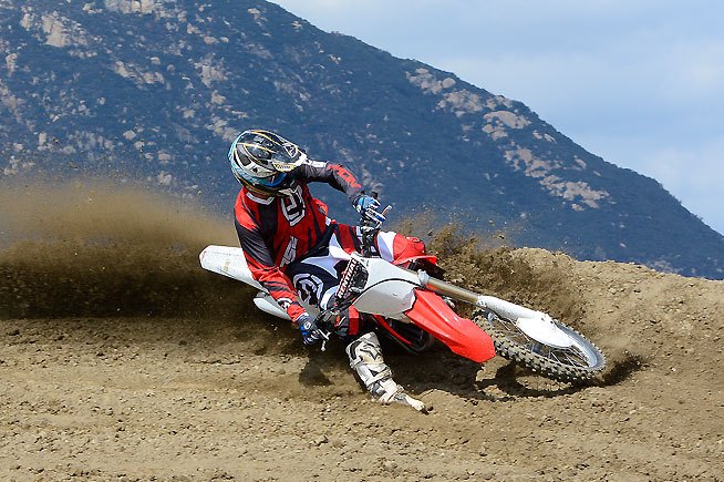 Previous CRF450R models tended to oversteer in corners, causing the front end to “knife” or grab traction earlier than the rider wanted. The new fork and revised linkage make the steering more neutral, helping to increase rider confidence.