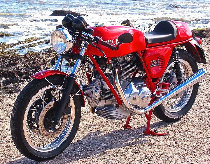 Some motorcycles, like the ’74 Ducati 750 Sport, dominate any background with their classic form. The author has let two of these get away over the years. Two. The shame. So this photo remains on the wall to remind him of his errant ways.