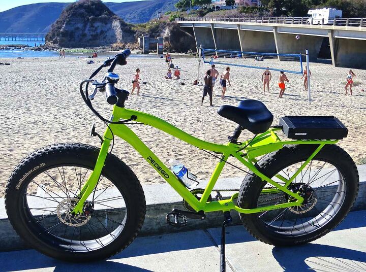 Yes, it is a bicycle. But it has a motor. An electric beach cruiser at the beach, with a beach volleyball backdrop. A possibility for the Avila Beach Chamber of Commerce calendar.