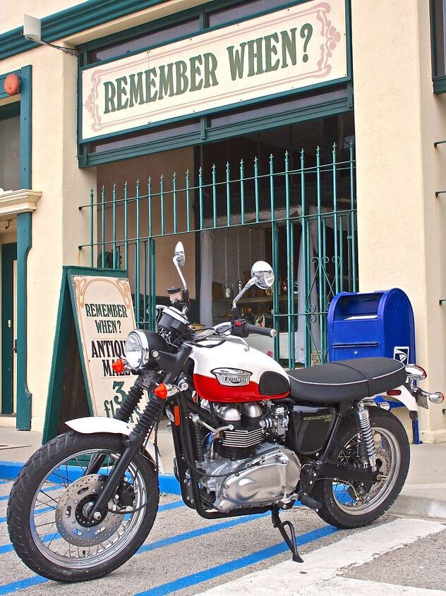 Now and again the motorcycle and backdrop are a thematic match. The retro Triumph Scrambler fits nicely in front of the antique shop, with a finishing vintage touch from the blue mailbox.