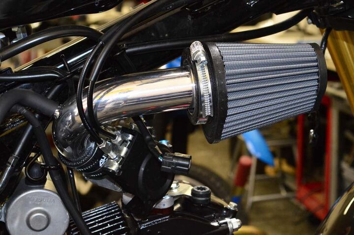 The air intake is a simple piece, with hose clamps connecting one end to the throttle body and the other end to the Sprint Filter.