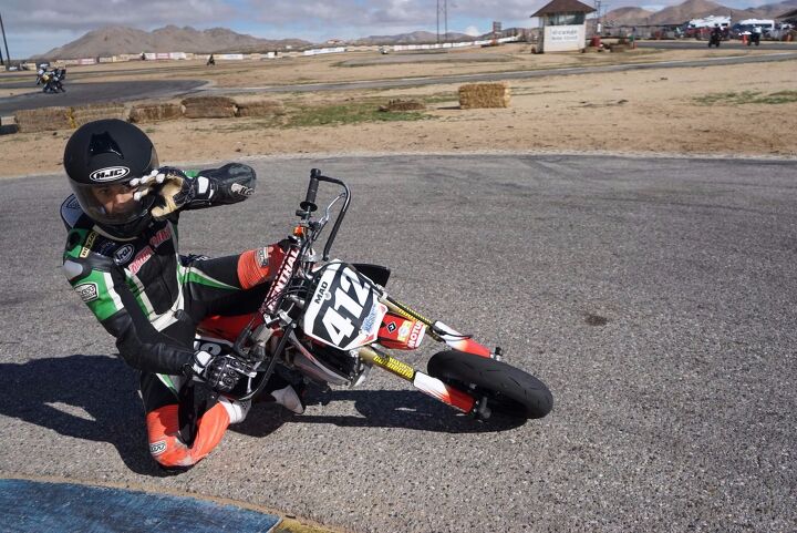 Rafael DiSilva getting a knee down with ease on the Mad Labs CRF150R and waving to the camera, too.