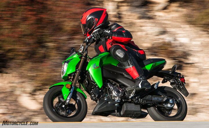Kevin’s notes say the Kawasaki Z125 has “Less seat-to-peg room than the others, but the most cornering clearance.” Here, Tom is graphically illustrating the seat-to-peg closeness. Check out how close his knee is to his elbow.
