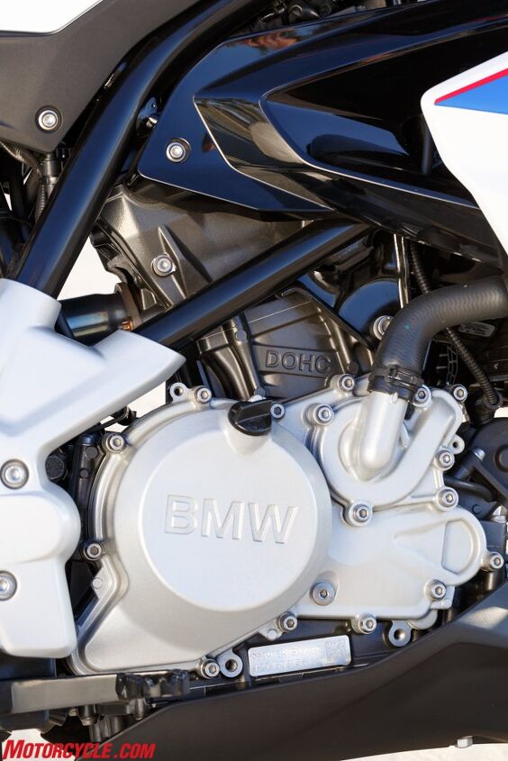 BMW’s 313cc Single powering the G310R breaks from tradition and has its cylinder head spun 180º compared to traditional single-cylinders. It’s also small, compact, and wedged as far forward as possible for better weight distribution. 