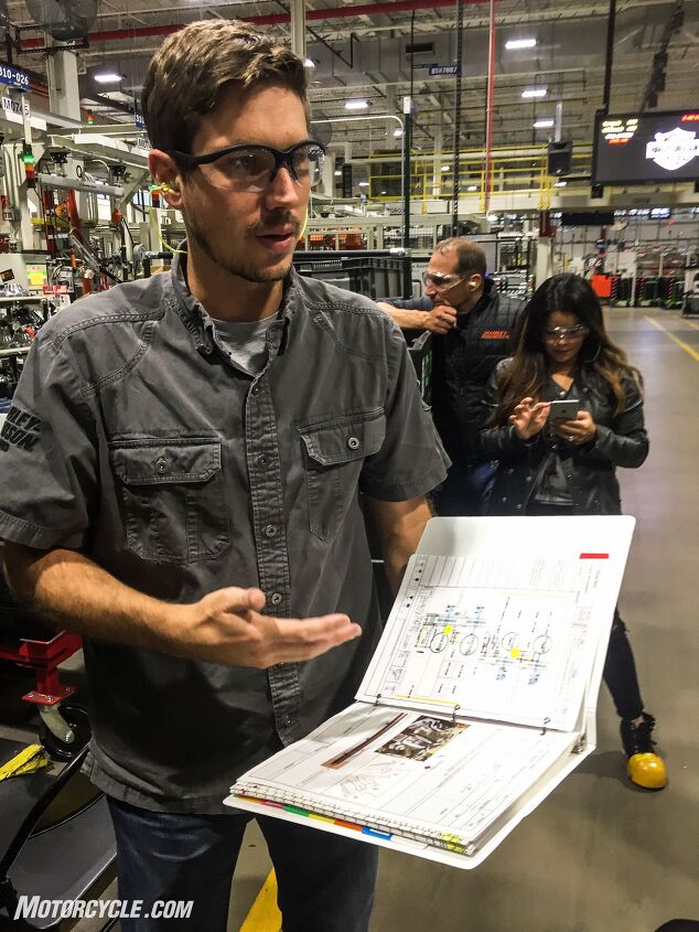 Manager of Engineering, Manufacturing Jared Olsen explains the importance of the Job Instruction Manual. This book contains the annotated assembly instructions jointly developed during the Milwaukee-Eight’s design by the engineers and the assembly line employees.