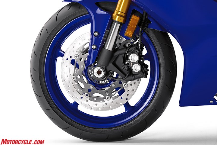Brake discs are bigger now, and the wheel-speed sensor in the center is used for both ABS and traction-control functions. Both Bridgestone and Dunlop are supplying tires for the R6.