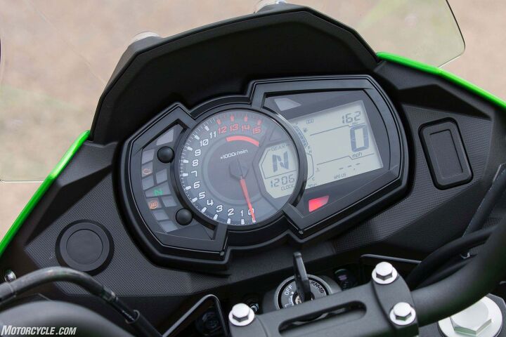 At least there’s a big tachometer – also everything else you need including a trip computer, which said my Versys was getting between 52 and 56 mpg over two days of riding. The round cutout to the left is for the accessory 12-volt outlet, the rectangular one at right is for the auxiliary lights switch.