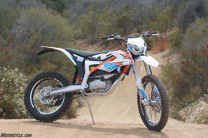 KTM’s Freeride-E boasts some impressive componentry. A chro-moly steel section in orange mates to a cast-aluminum configuration below the seat to comprise the frame, while the subframe is a high-tech plastic structure that helps shave weight. Wheels feature aluminum rims and spoke nipples and CNC-machined hubs. Aluminum swingarm with a machined section shows attention to detail. Without its battery, the bike would weigh less than 190 pounds.