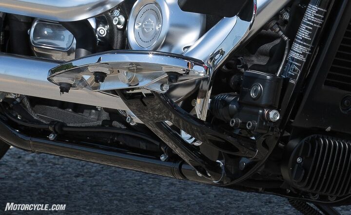 The forged aluminum floorboard brackets assist in both the improved lean angle and the weight loss.