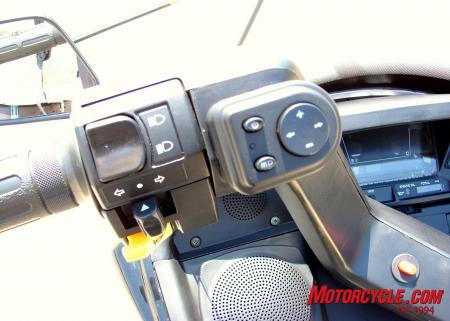 Here you can see the speaker covers and the FM / MP3 player controls. The orange button in the center of the handle bars is the hazard lights button.