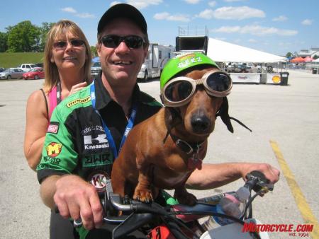 The paddock scene is often a great place to be, especially with characters (and Hall-of-Famers) like Jay Springsteen around. Here Springer is sandwiched by wife Judy and pooch Diesel.