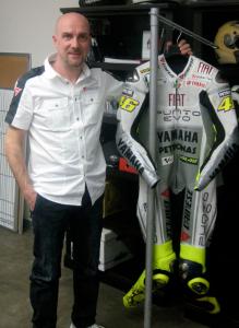 Silvano Celi poses next to the D-Air prototype race suit.