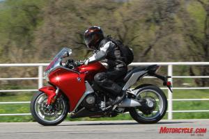 The VFR’s bars are slightly higher than the K1300’s, but it has a slightly shorter seat-to-peg distance.