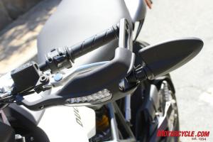 Slim LED turn signals integrated into hand guards and folding bar-end mirrors are a carryover from the 796’s bigger brother, the Hypermotard 1100.