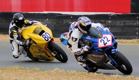 TTXGP race-winner Shawn Higbee (22) leads Michael Barnes (80) at Infineon Raceway. Barnie's bike had superior acceleration that offset Higbee's faster cornering speeds. Reliability issues for Barnes' bike stopped this battle and forced him to limp home in second place. (Photo by Mike Finnegan)
