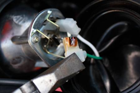 One of the leads to the H1 halogen bulb had started to get too hot.