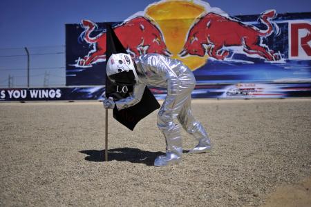 Jorge Lorenzo celebrated his win by dressing up as an astronaut planting his flag.
