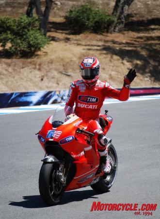 Nicky Hayden waves to the crowd in the Corkscrew at the end of the race. Despite no podium placing for Hayden, his sixth-place finish in the 2010 Laguna Seca MotoGP was respectable. American fans seemed to approve of his efforts.