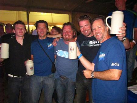 Under the big tent in the evenings at Motorrad Days everyone lets their hair down. (Jon Beck- second from left. Charlie Boorman – third from left. Jeff Buchanan – right).