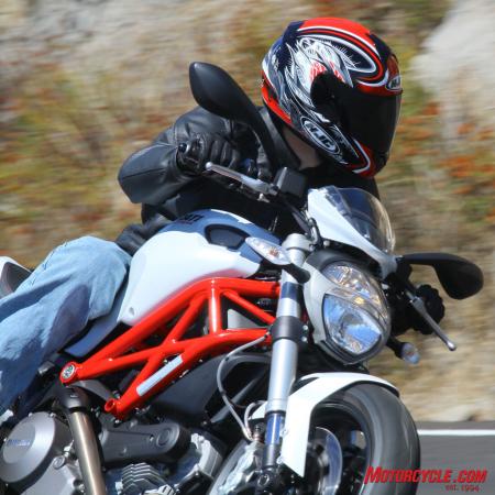 “Micro-bikini” fairing comes standard. One-piece tubular handlebar is a little less than an inch higher than the Monster 1100’s bar. The headlight is identical to headlights on the 696 and 1100.