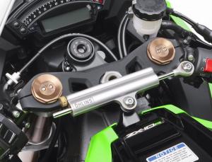 An Ohlins steering damper thwarts any instability caused by the Ninja’s sharper steering geometry. Note the pair of damping adjusters atop the Showa BPF fork tubes.