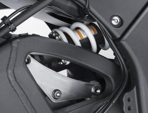 A new shock arrangement offers shelter from exhaust heat, stabilizing its damping performance.