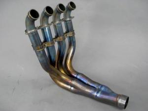 This beautiful exhaust header is made of lightweight titanium and is claimed to have nearly the same diameter and length as factory racing headers, so a simple aftermarket slip-on muffler should yield a better-than-typical performance boost. 