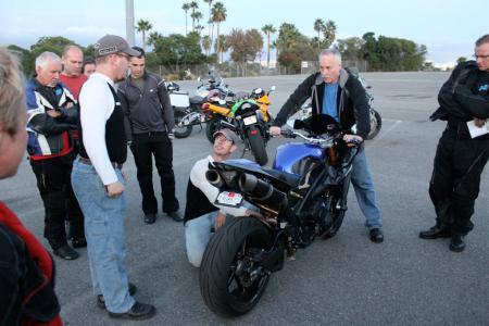 Lee Parks, Terry Watts (center) and Tracy Martin (right) show how to set sag, rebound and compression damping on what Parks said was the most blinged out motorcycle to have come through his classes. This R1 had been kitted with Ohlins suspension, motor work, and carbon fiber everything, including wheels, brakes, fairing.