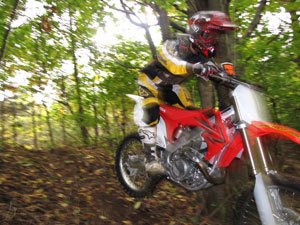 In the woods the instant throttle response of the CRF450 can simply be too much, too soon.