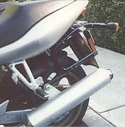 Hard luggage attachment system. Note exhaust relocation bracket 