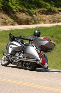 The Victory Vision Tour has the capacious tail trunk that augments the swoopy-but-not-huge saddlebags. The $1000-cheaper Vision Street goes without the hatchback.
