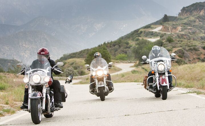 Four leather baggers on a mountain road
