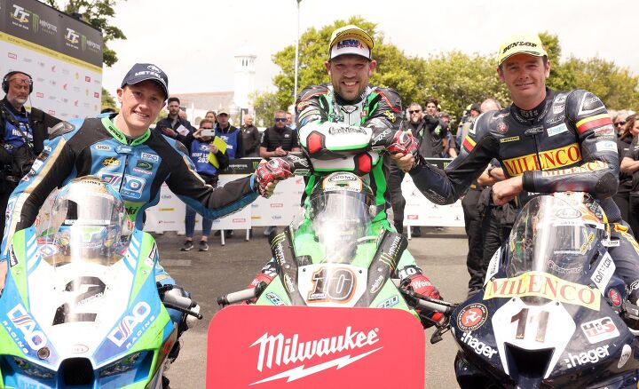 PACEMAKER, BELFAST, 11/6/2022: Peter Hickman (Gas Monkey BMW) celebrates after winning today's Senior TT at TT2022 with runner up Dean Harrison (DAO Racing Kawasaki) and third placed Conor Cummins (Milenco Padgett's Honda). PICTURE BY STEPHEN DAVISON
